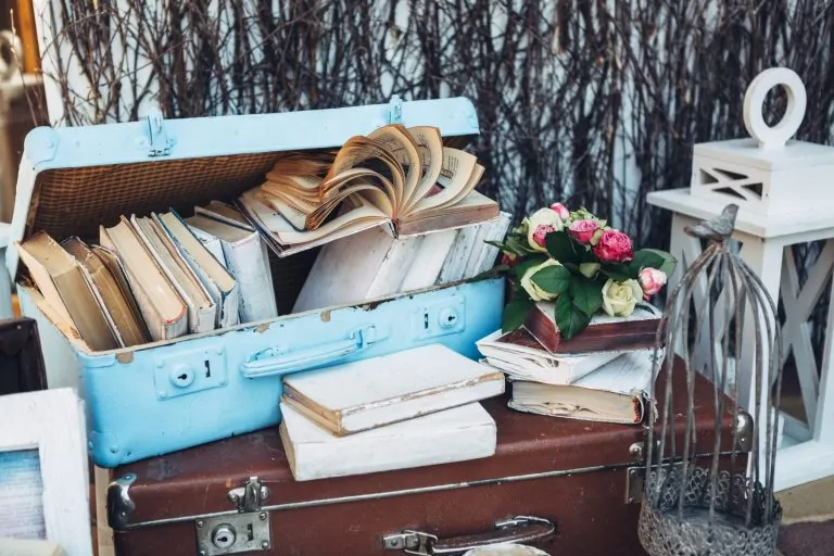 Sentimental items such as photos, letters and keepsakes organized in boxes during decluttering before moving.