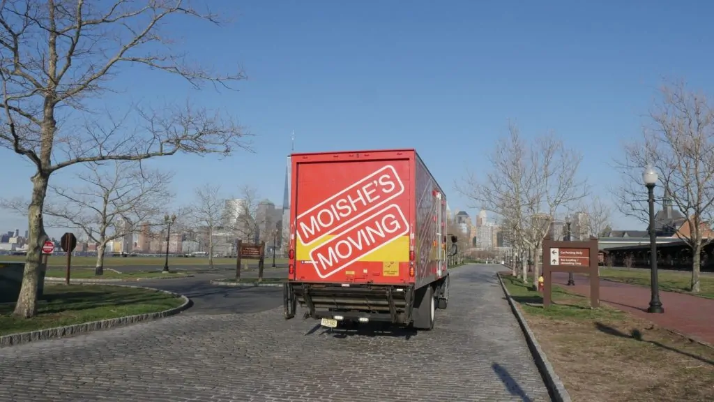Professional movers in NYC - Moishe's Moving truck parked on a New York City