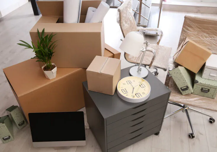 Moving Boxes And Furniture In New Office