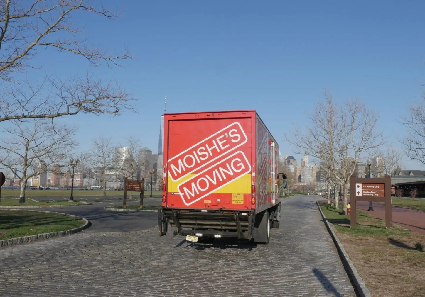 Professional movers in NYC - Moishe's Moving truck parked on a New York City