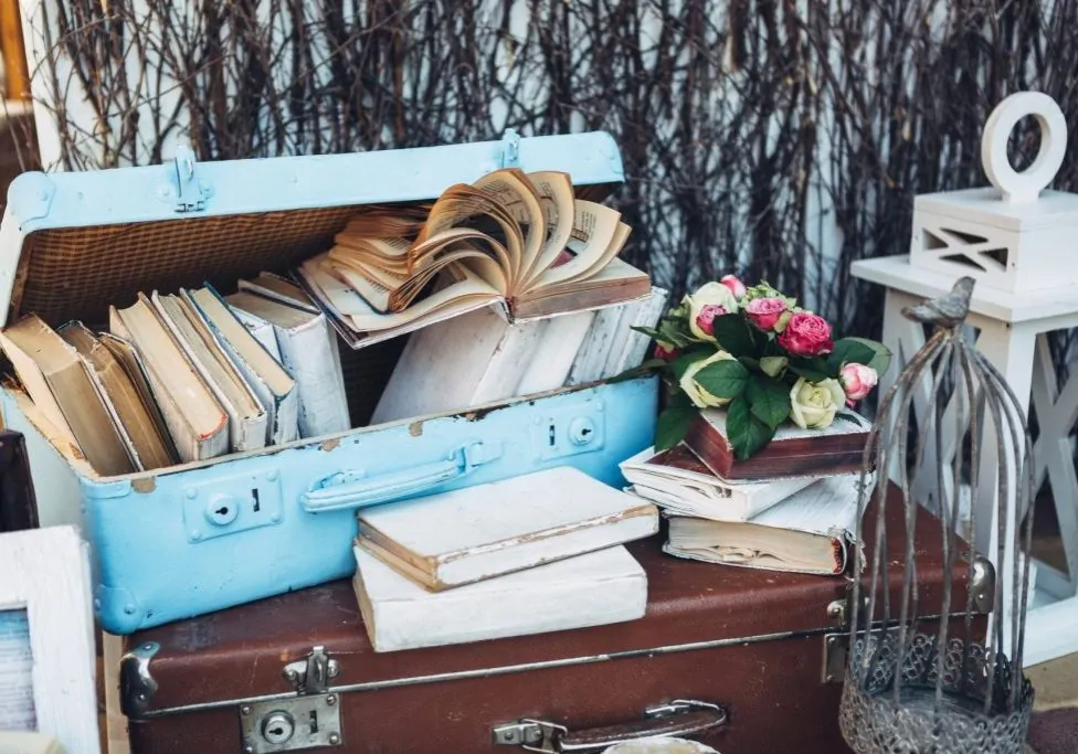 Sentimental items such as photos, letters and keepsakes organized in boxes during decluttering before moving.